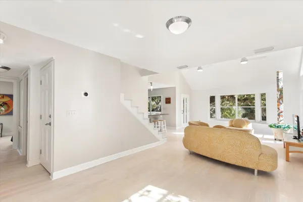a bedroom with a bed and a potted plant