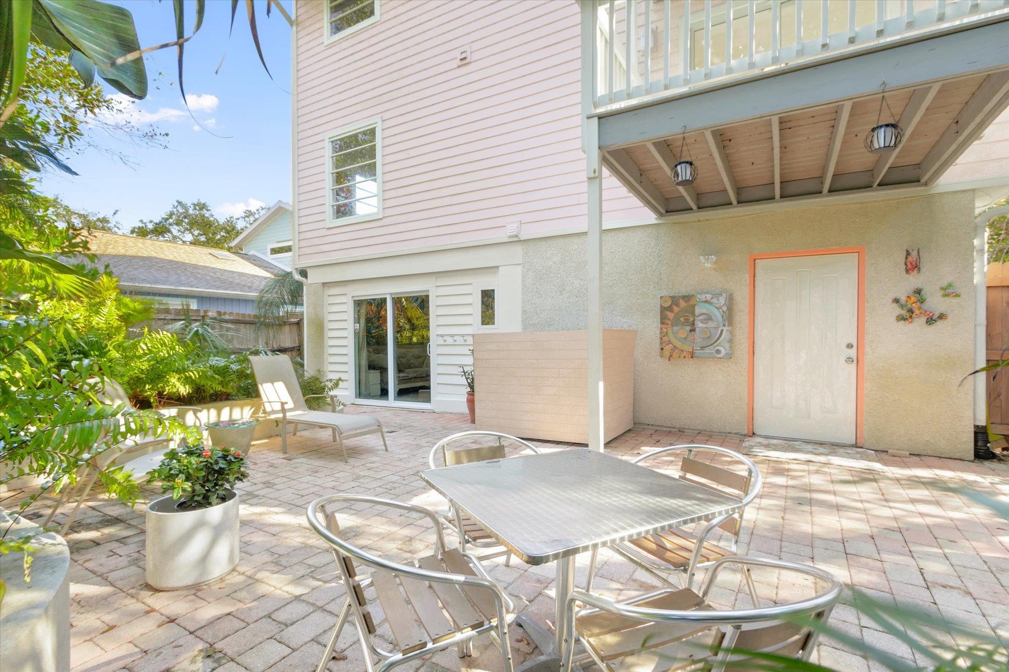 1685 Santander Street St. Augustine, FL 32080 - Photo 38 of 48 a view of a patio with table and chairs and potted plants