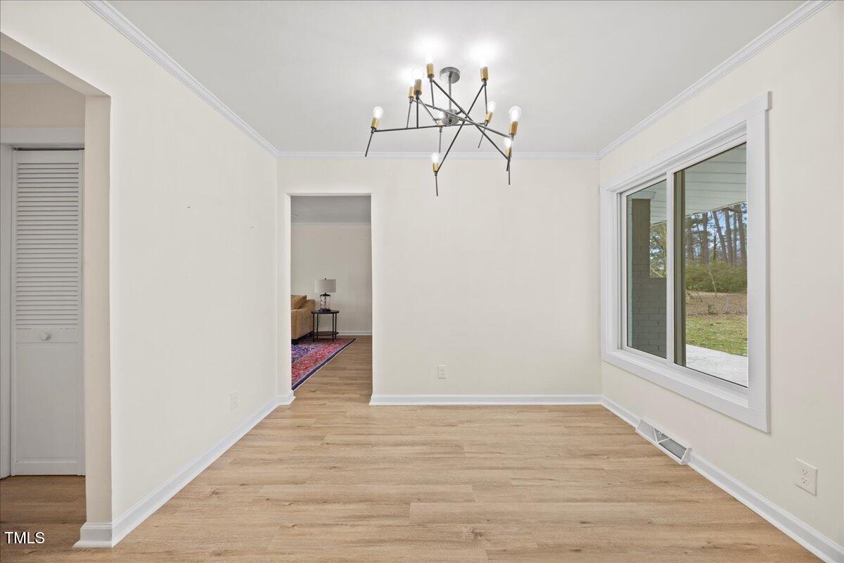 2013 Dartmouth Drive Durham, NC 27705 - Photo 13 of 32 a view of a room with wooden floor closet and windows