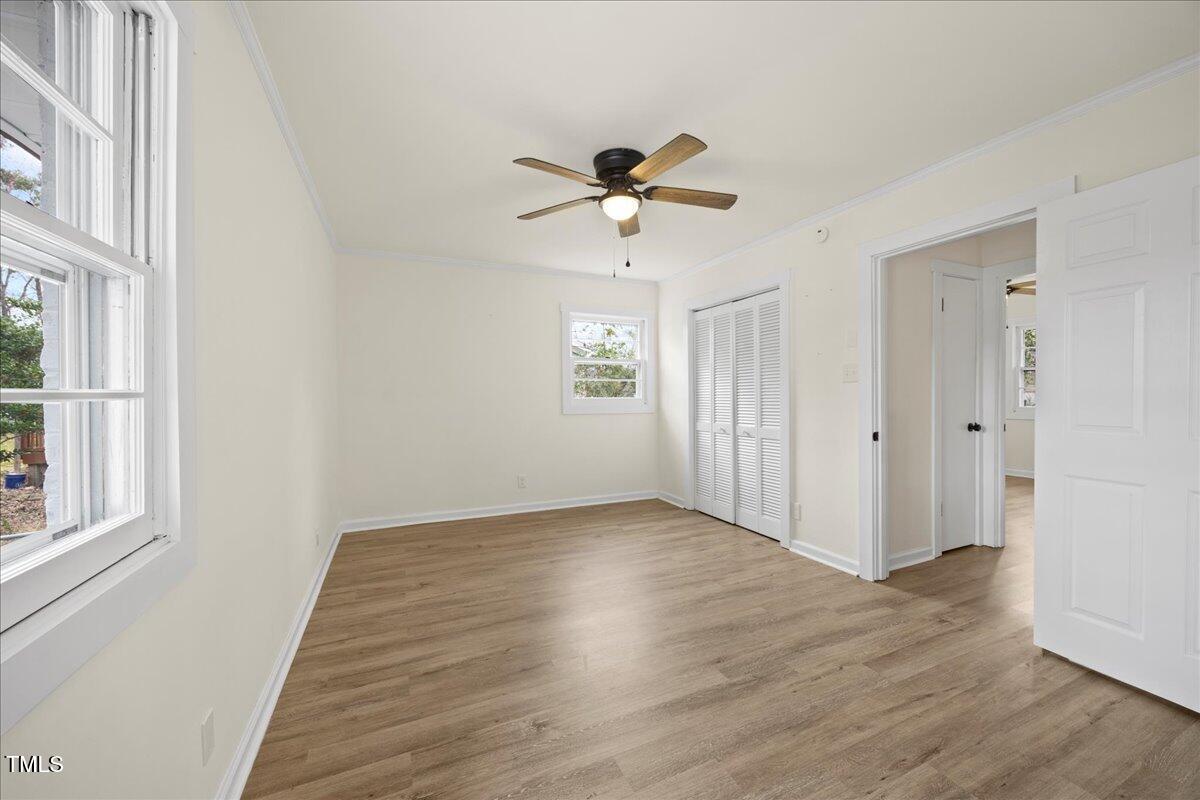 2013 Dartmouth Drive Durham, NC 27705 - Photo 15 of 32 wooden floor in an empty room with a window