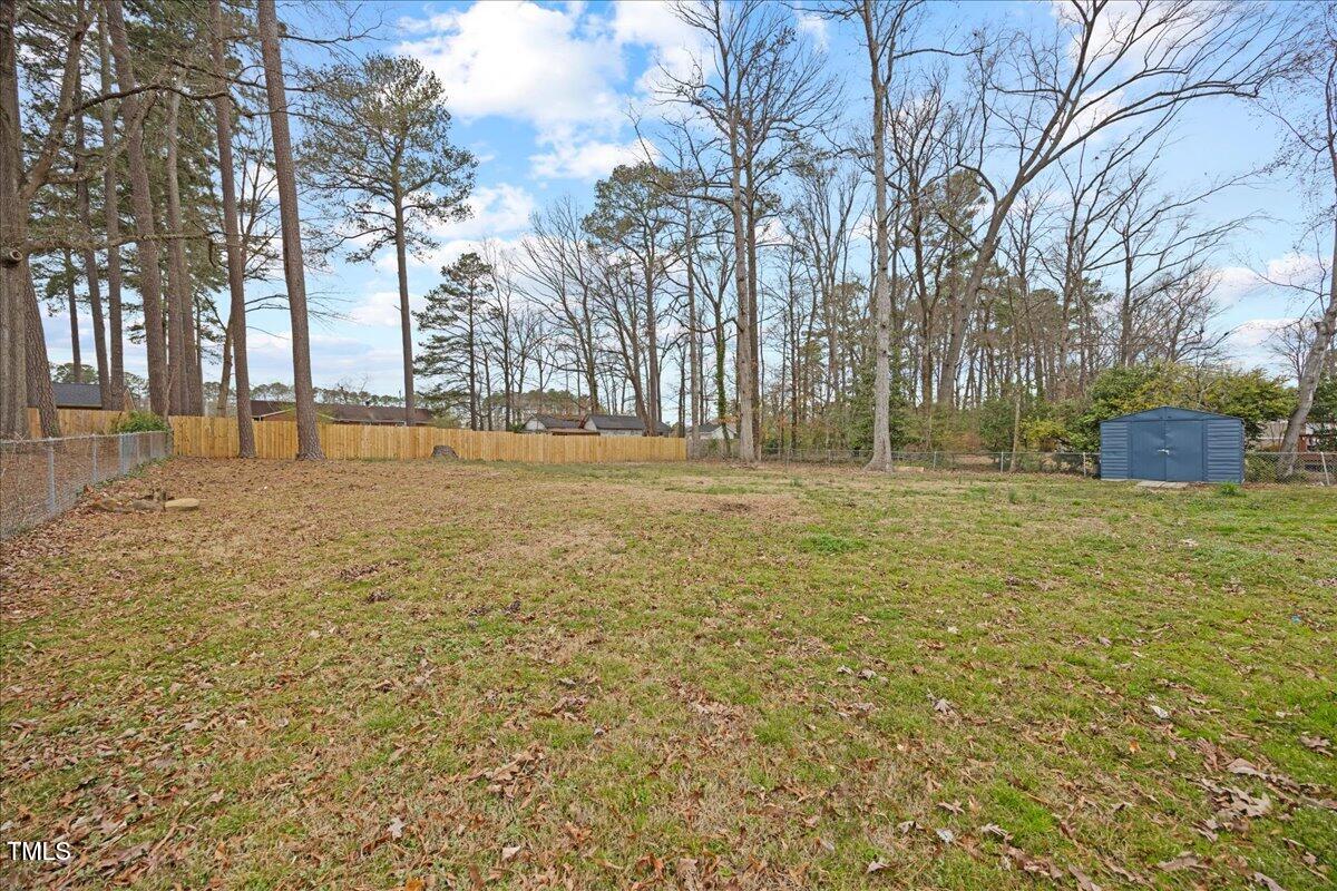 2013 Dartmouth Drive Durham, NC 27705 - Photo 29 of 32 a backyard of apartments with large trees