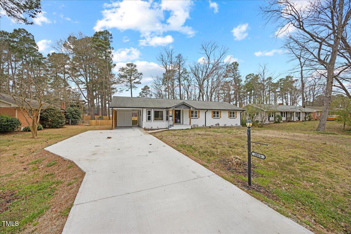 2013 Dartmouth Drive Durham, NC 27705 - Photo 4 of 32 a view of a house with a yard