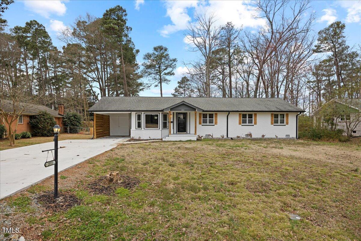 2013 Dartmouth Drive Durham, NC 27705 - Photo 5 of 32 a front view of a house with a yard