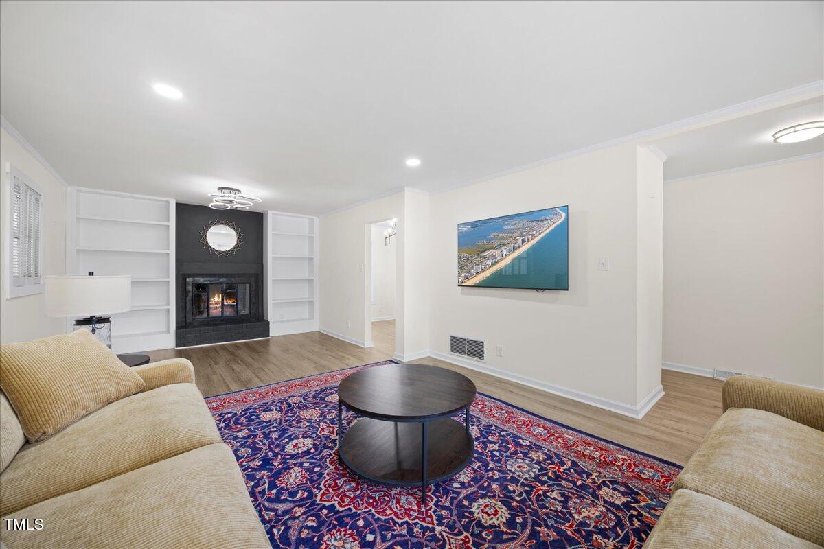 2013 Dartmouth Drive Durham, NC 27705 - Photo 9 of 32 a living room with furniture and a fireplace