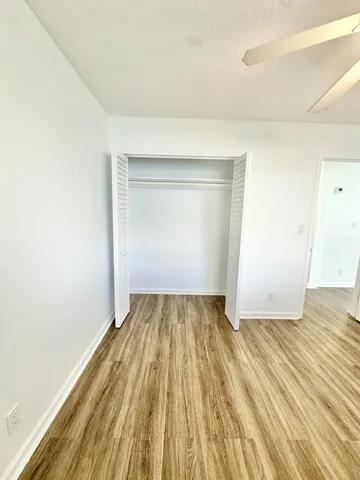 an empty room with wooden floor