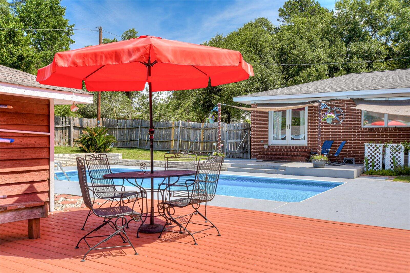 308 5th Street Jackson, SC 29831 - Photo 58 of 70 a view of a patio with a table and chairs under an umbrella
