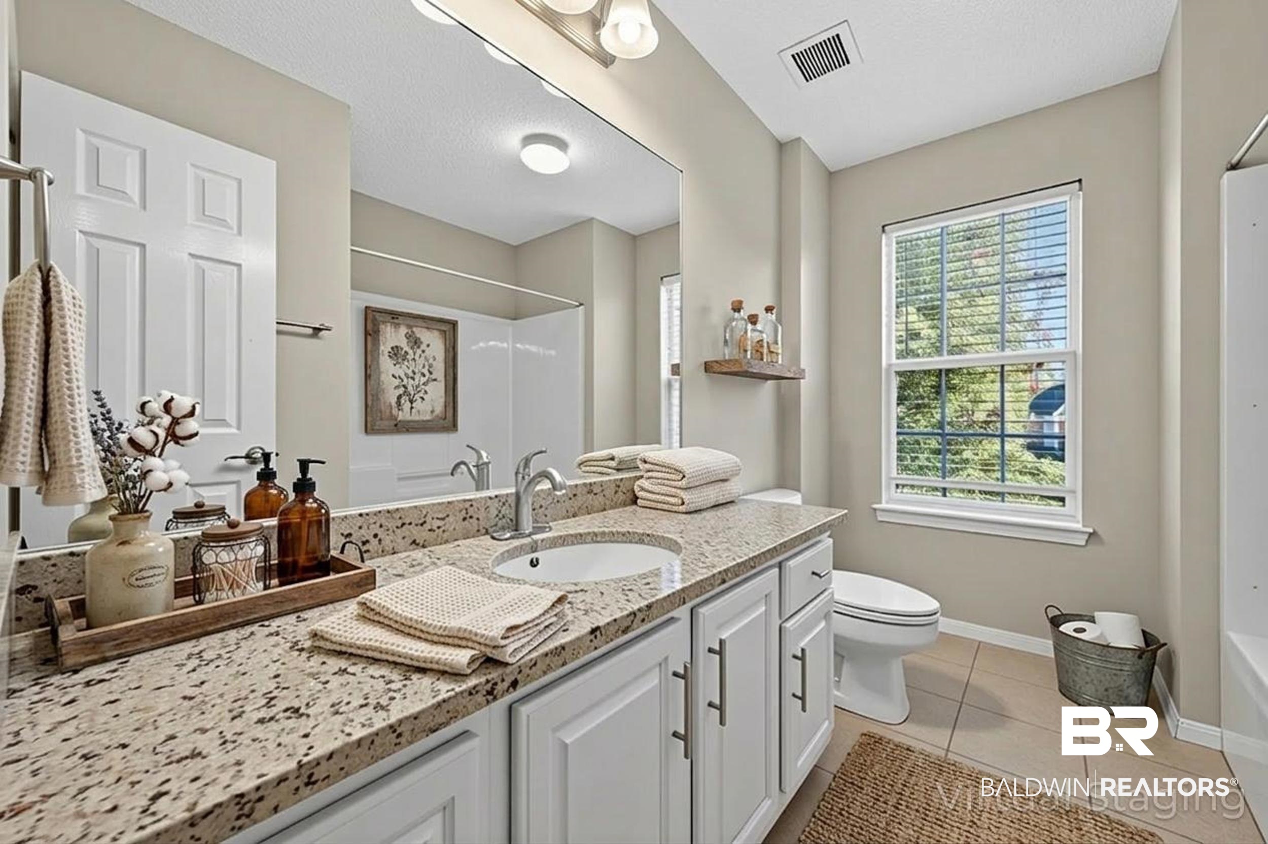 7050 Highpointe Place West Daphne, AL 36527 - Photo 53 of 66 Bathroom with vanity, light tile patterned floors, and a textured ceiling