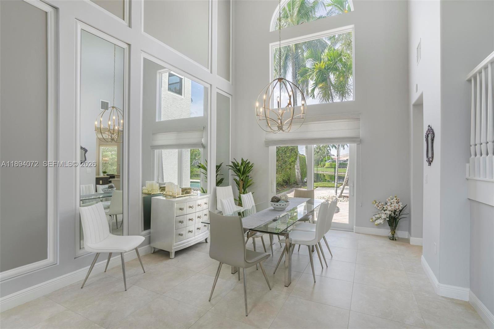 11750 Bayfield Drive Boca Raton, FL 33498 - Photo 12 of 52 a view of a dining room with furniture window and outside view