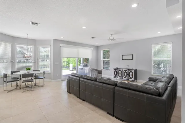 a large kitchen with stainless steel appliances lots of counter top space