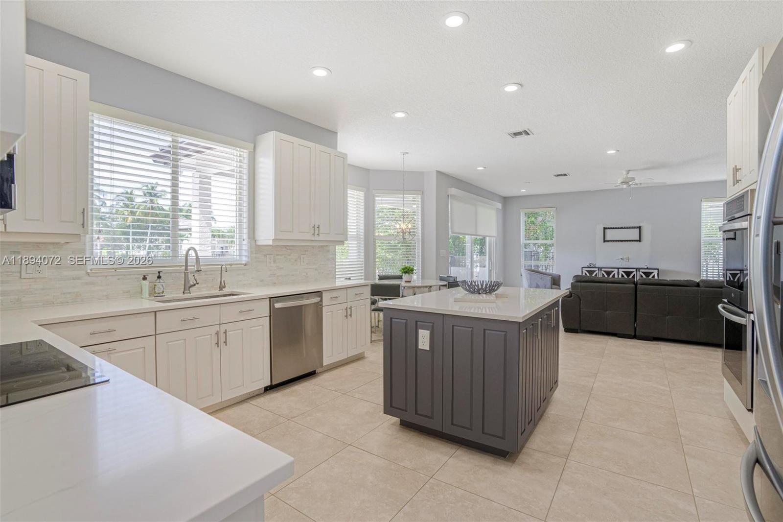 11750 Bayfield Drive Boca Raton, FL 33498 - Photo 20 of 52 a large kitchen with stainless steel appliances lots of counter top space