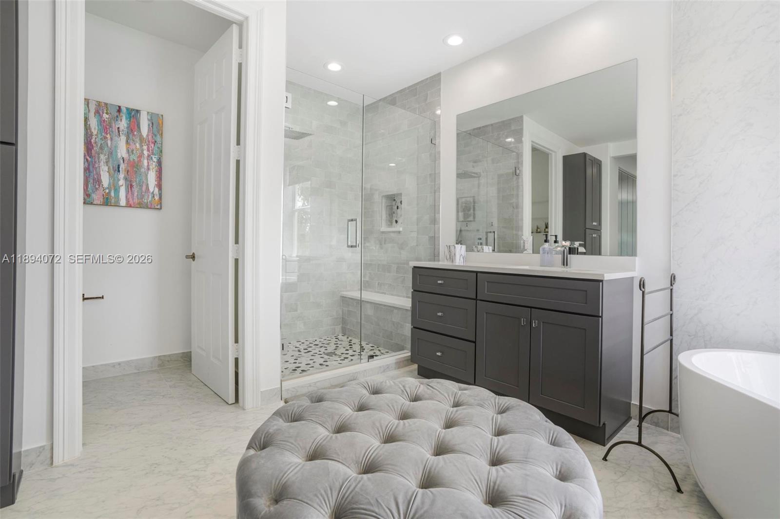 11750 Bayfield Drive Boca Raton, FL 33498 - Photo 30 of 52 a bathroom with a sink and a mirror