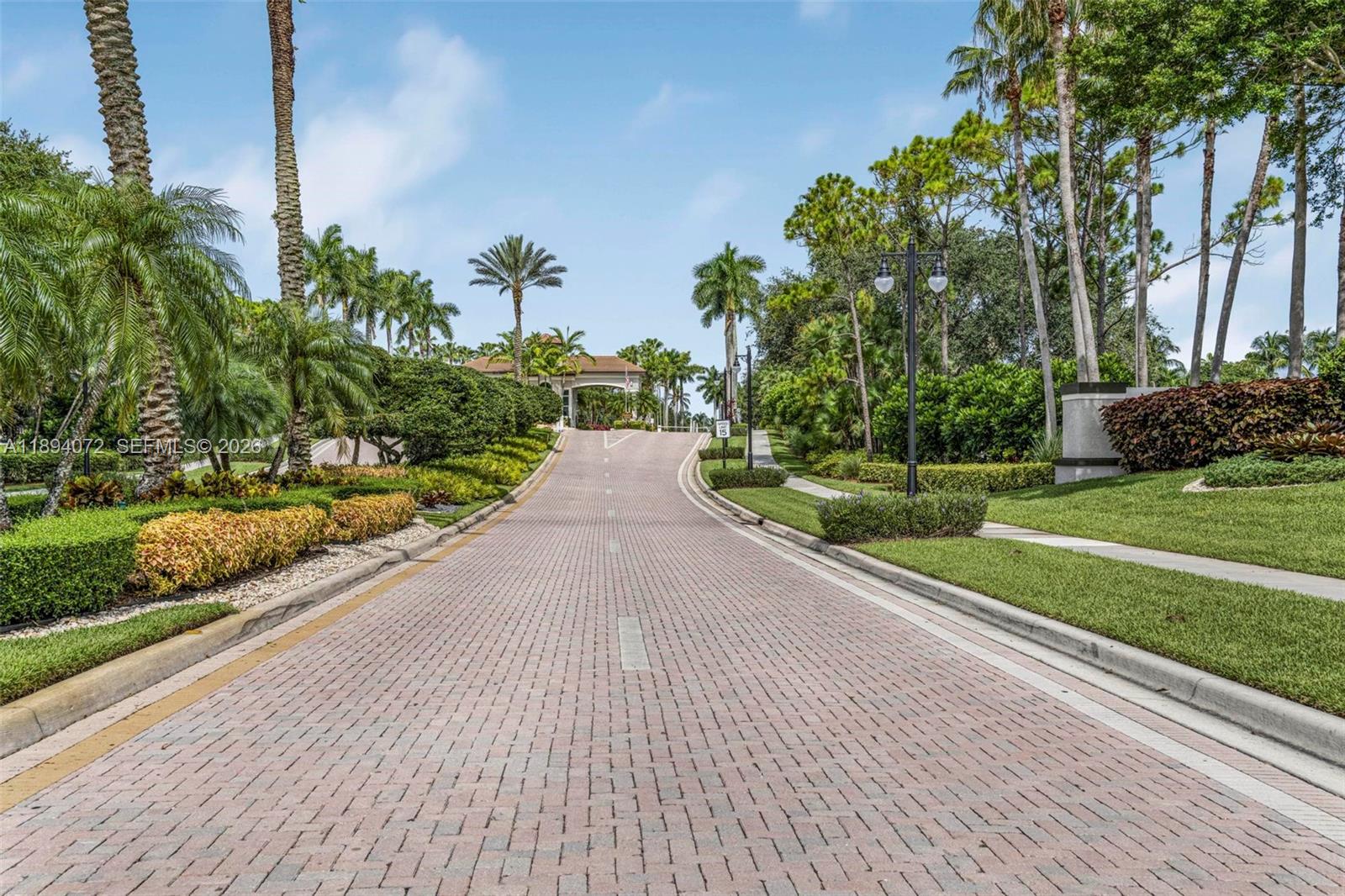 11750 Bayfield Drive Boca Raton, FL 33498 - Photo 3 of 52 a view of a garden with a pathway