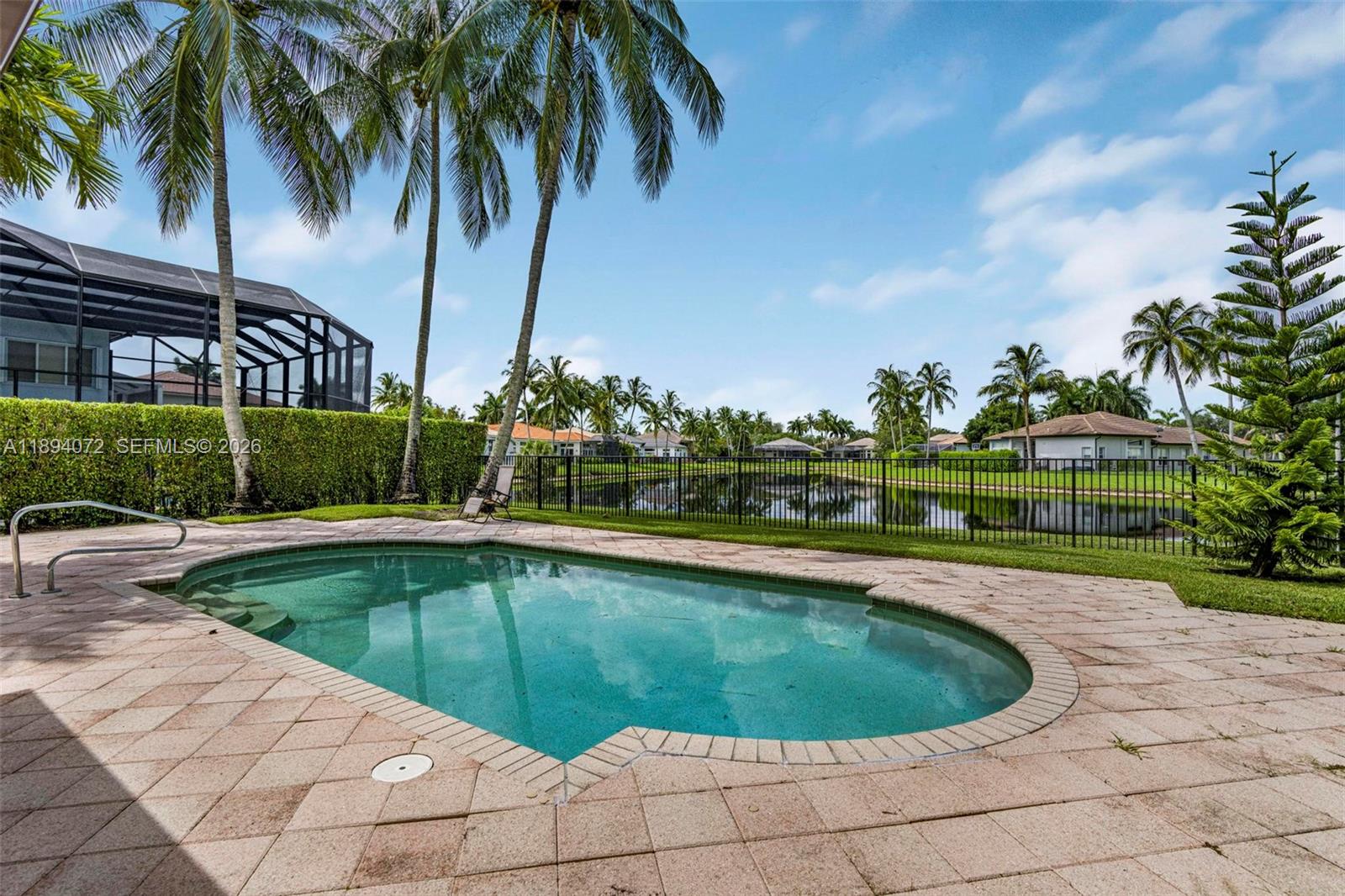 11750 Bayfield Drive Boca Raton, FL 33498 - Photo 39 of 52 a view of swimming pool having outdoor seating