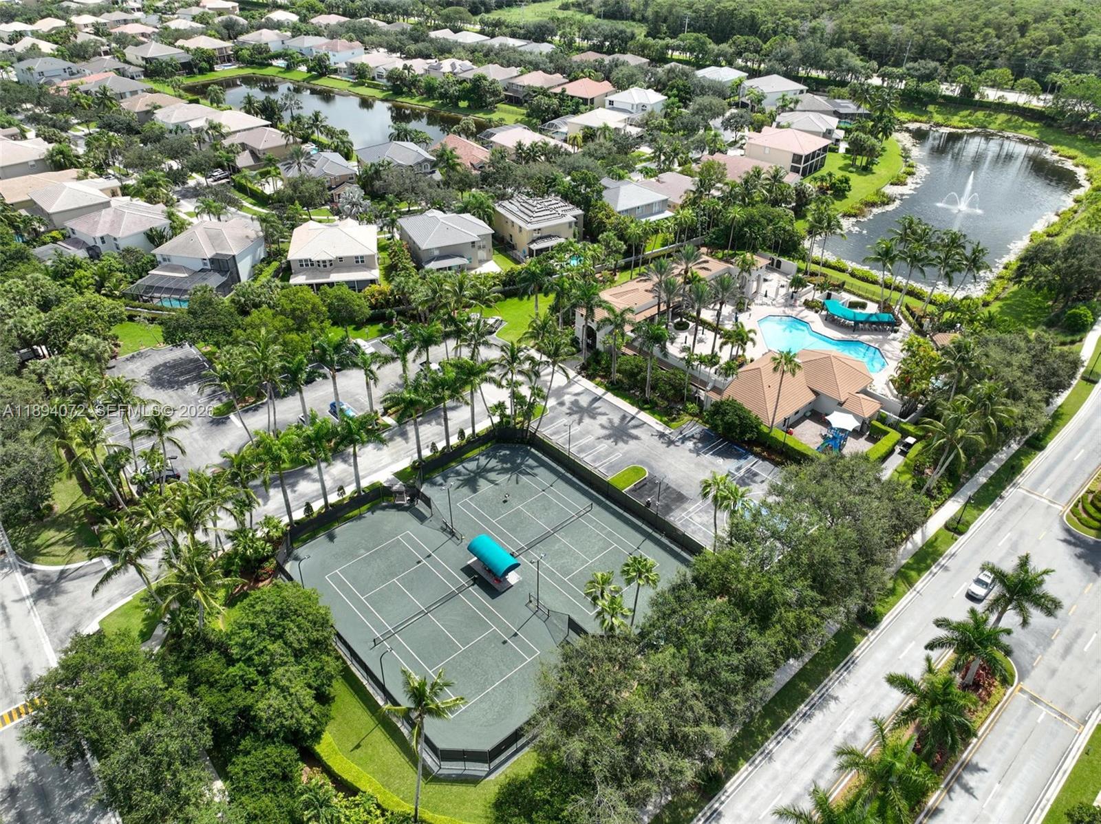 11750 Bayfield Drive Boca Raton, FL 33498 - Photo 49 of 52 an aerial view of residential houses with outdoor space and trees