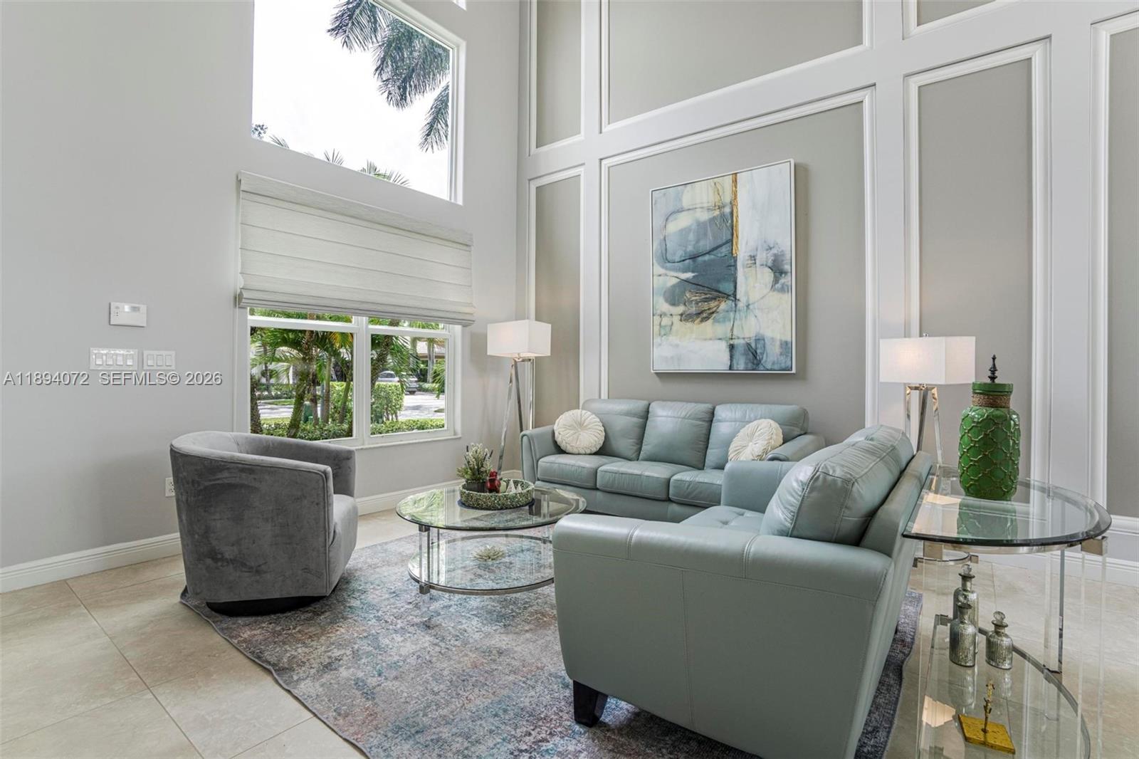 11750 Bayfield Drive Boca Raton, FL 33498 - Photo 9 of 52 a living room with furniture and a window