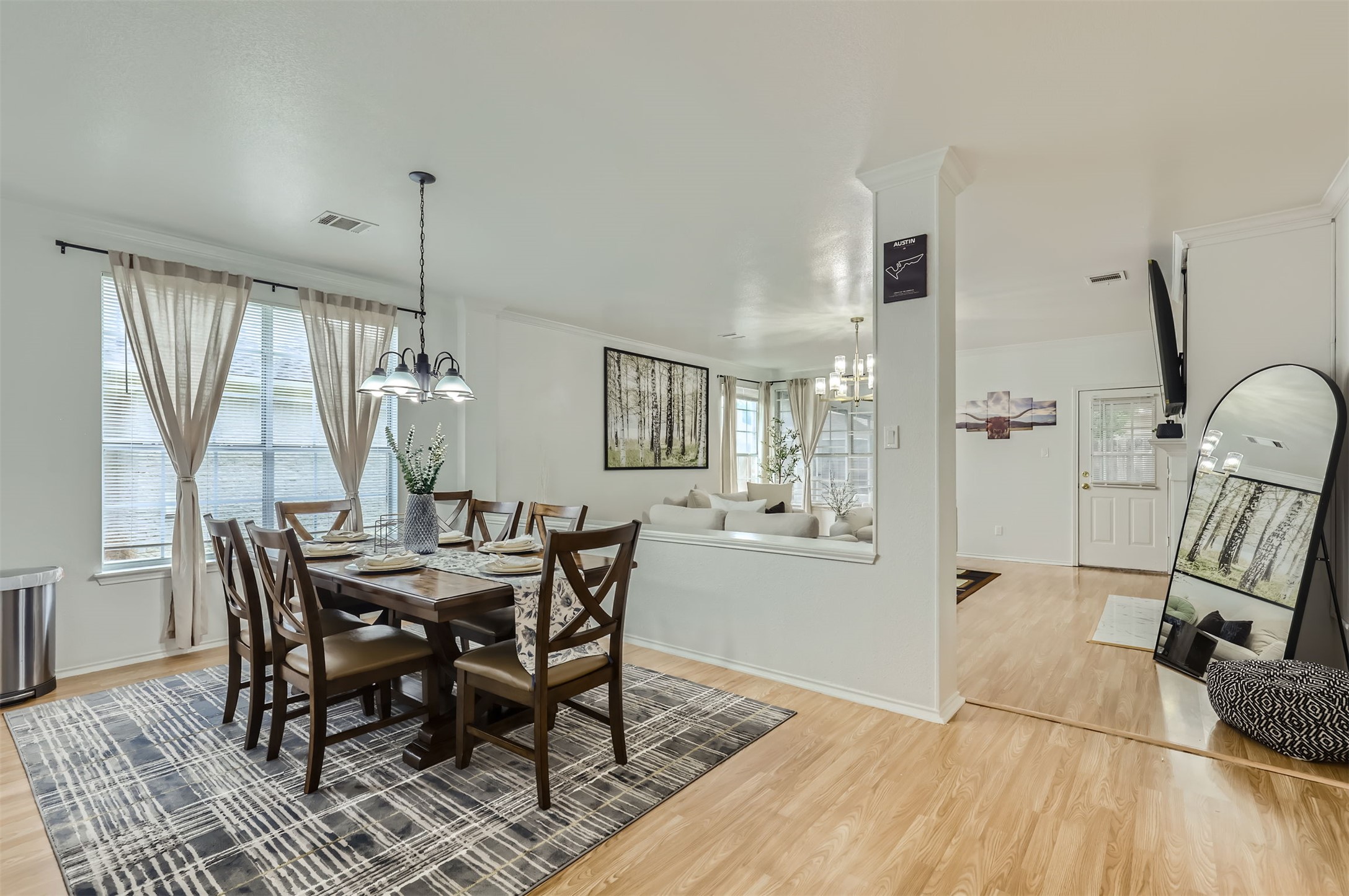 1016 Thackeray Lane Pflugerville, TX 78660 - Photo 11 of 28 Dining room with a chandelier and light wood-type flooring