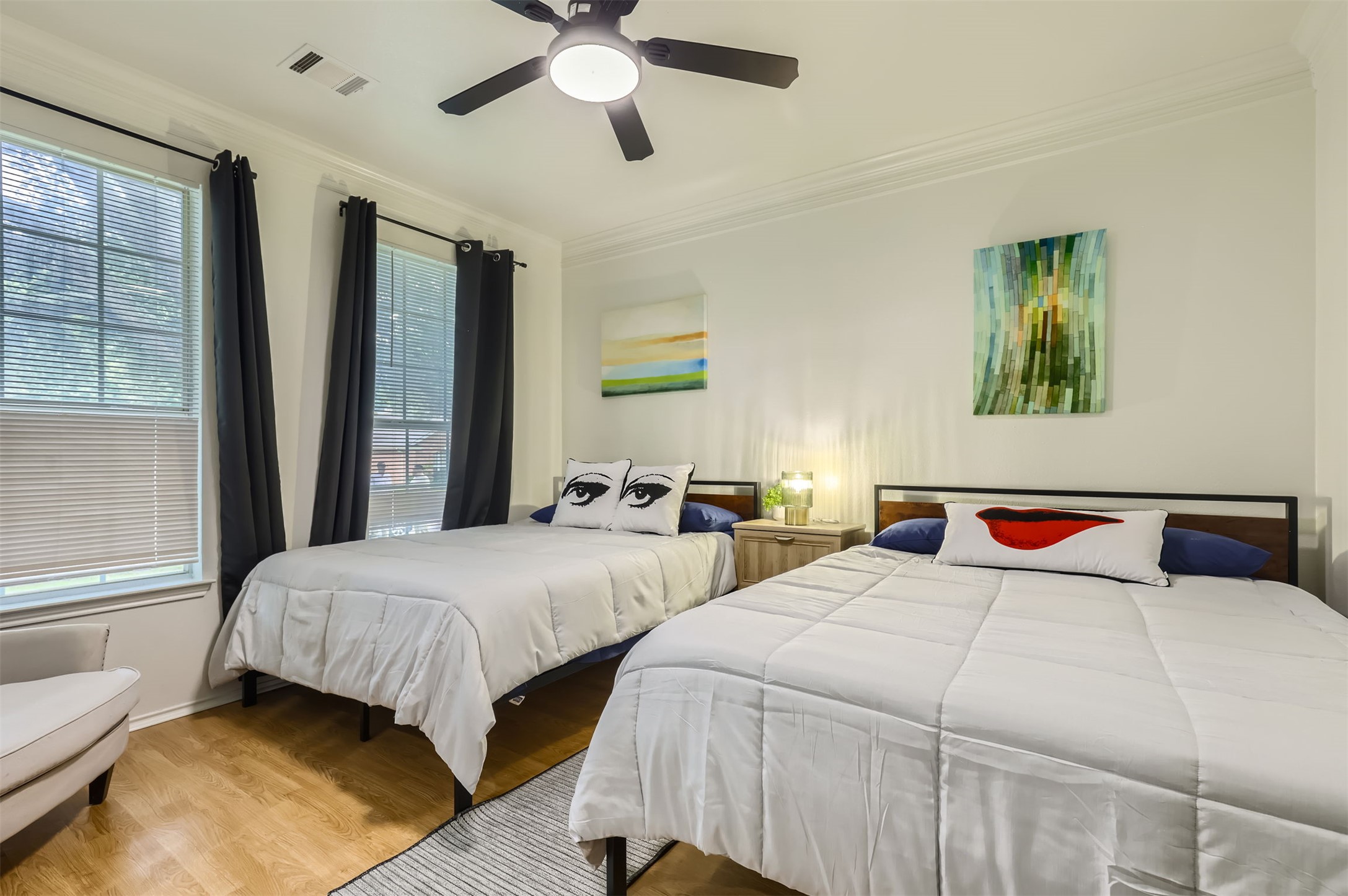 1016 Thackeray Lane Pflugerville, TX 78660 - Photo 12 of 28 Bedroom with wood finished floors, crown molding, multiple windows, and ceiling fan