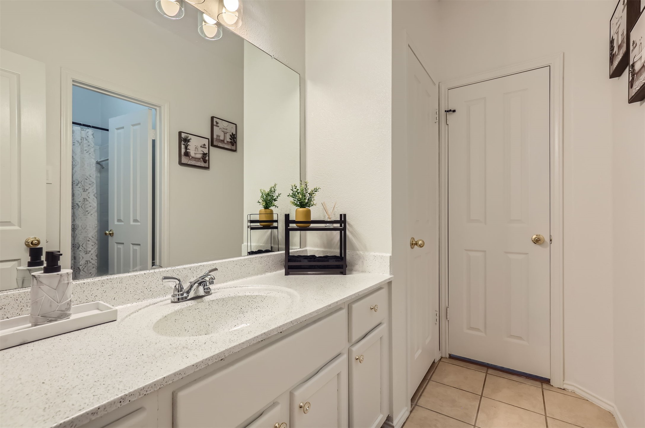 1016 Thackeray Lane Pflugerville, TX 78660 - Photo 22 of 28 Full bathroom with vanity and tile patterned floors