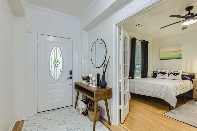 a bedroom with bed and a window