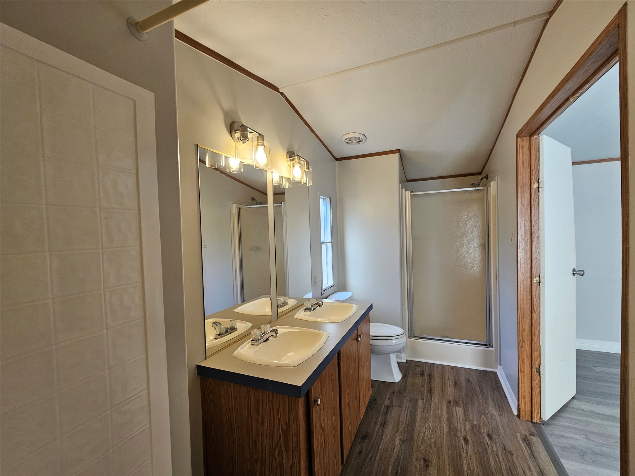14225 East Ravine Run Willis, TX 77318 - Photo 15 of 27 a bathroom with a sink a mirror and a shower