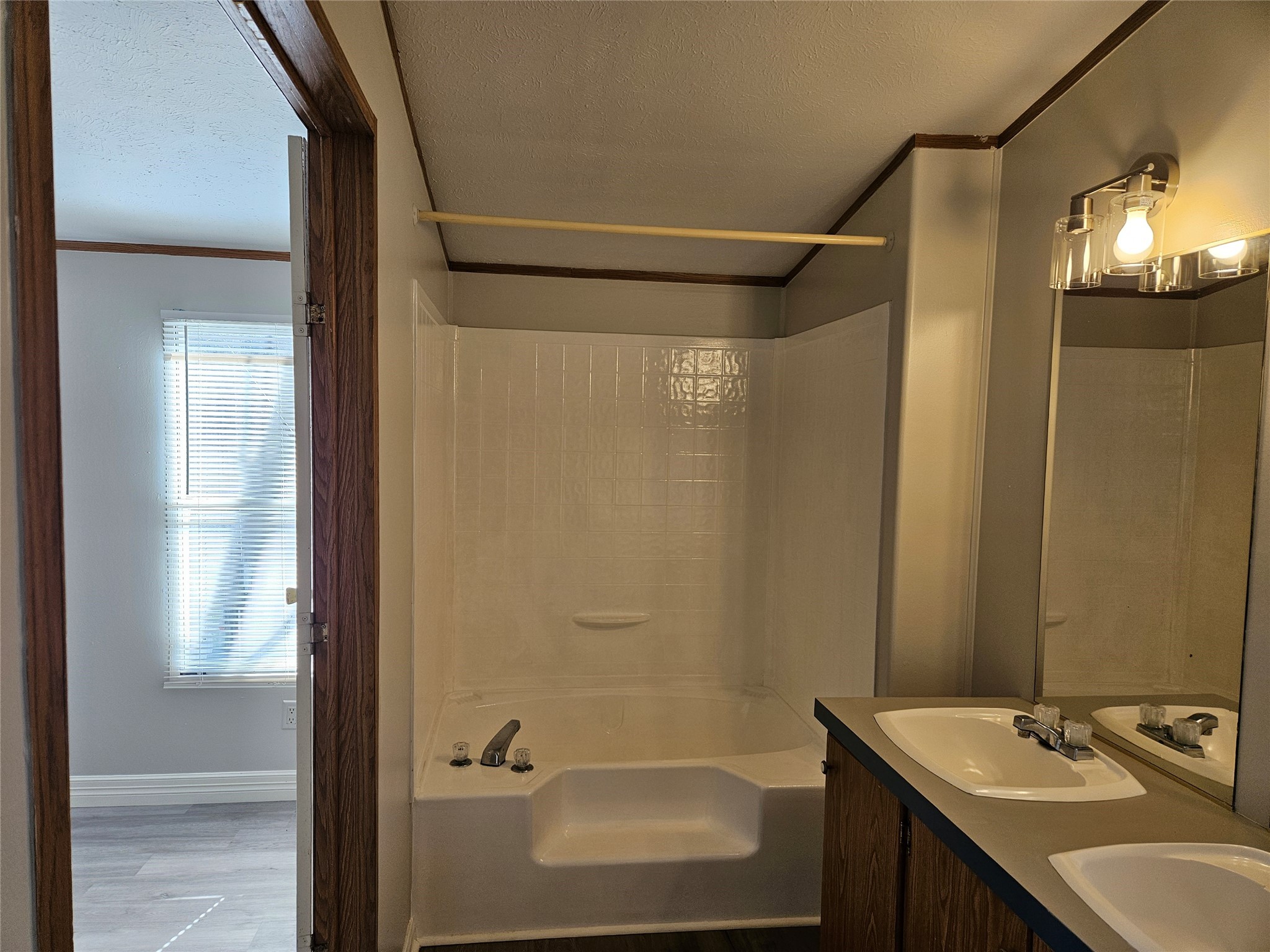 14225 East Ravine Run Willis, TX 77318 - Photo 16 of 27 a bathroom with a sink and a mirror