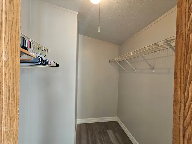 a view of storage and utility room with racks on the wall