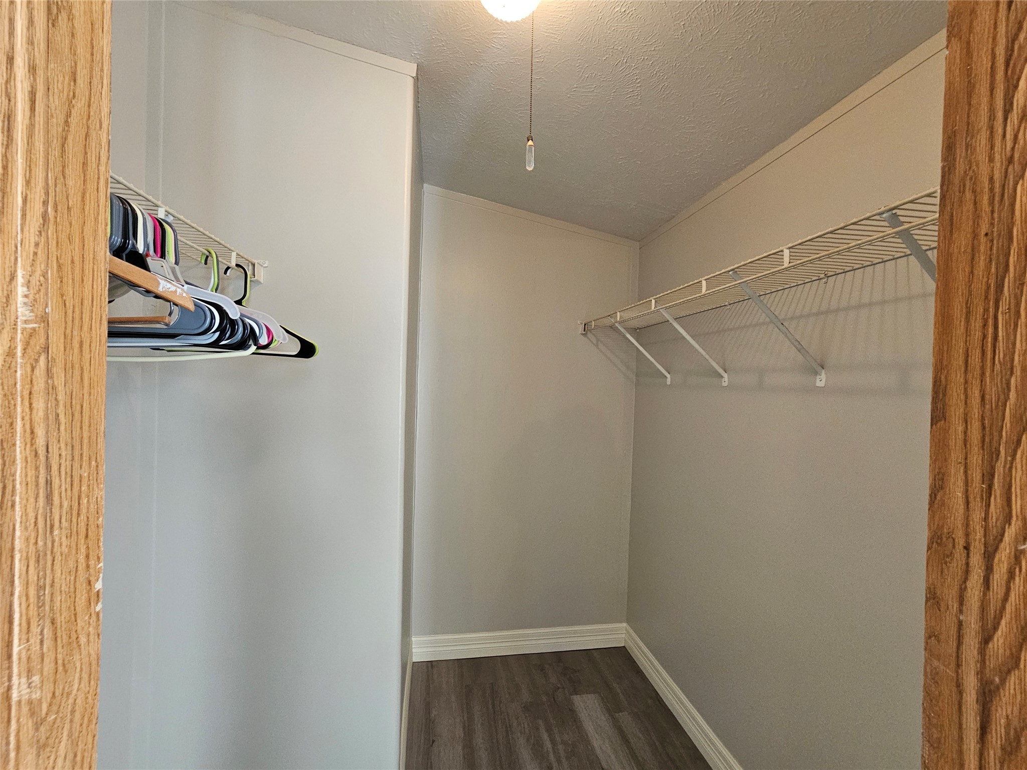 14225 East Ravine Run Willis, TX 77318 - Photo 18 of 27 a view of storage and utility room with racks on the wall
