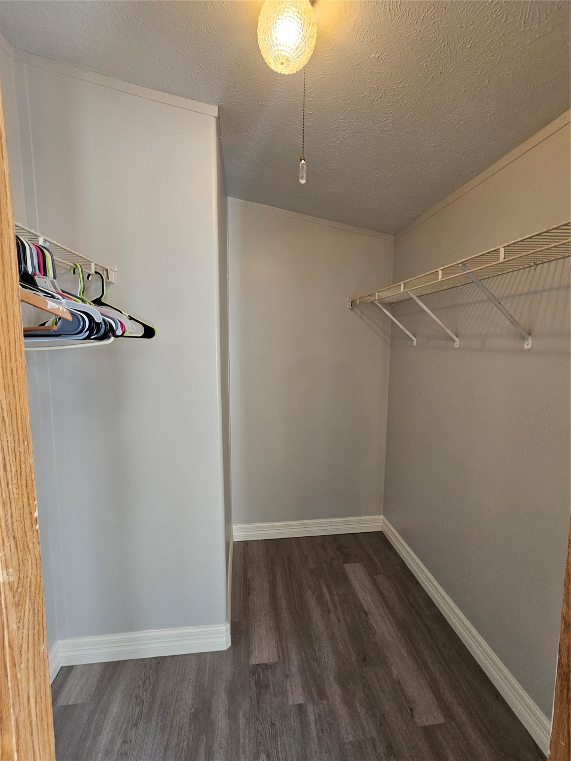 14225 East Ravine Run Willis, TX 77318 - Photo 19 of 27 a view of a room with racks on the wall