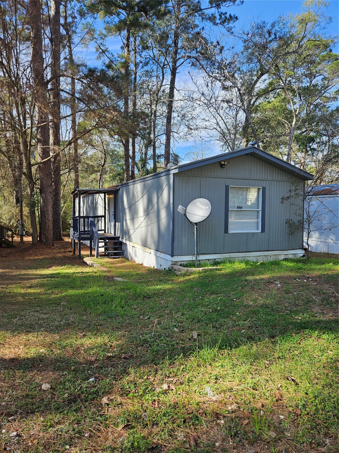 14225 East Ravine Run Willis, TX 77318 - Photo 2 of 27 a backyard of a house with lots of green space
