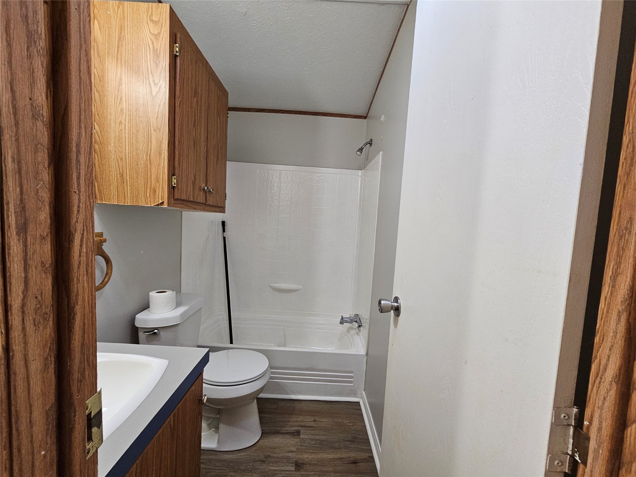 14225 East Ravine Run Willis, TX 77318 - Photo 24 of 27 a bathroom with a sink a toilet and shower