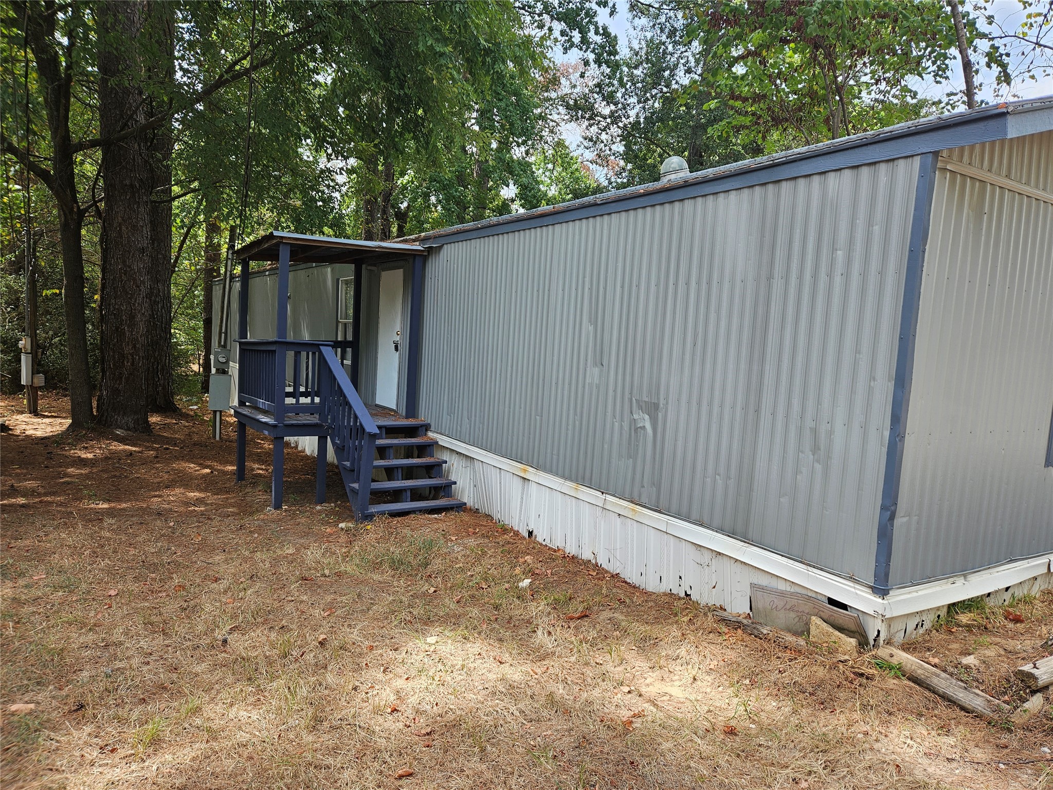 14225 East Ravine Run Willis, TX 77318 - Photo 27 of 27 a view of backyard with wooden fence and a bench