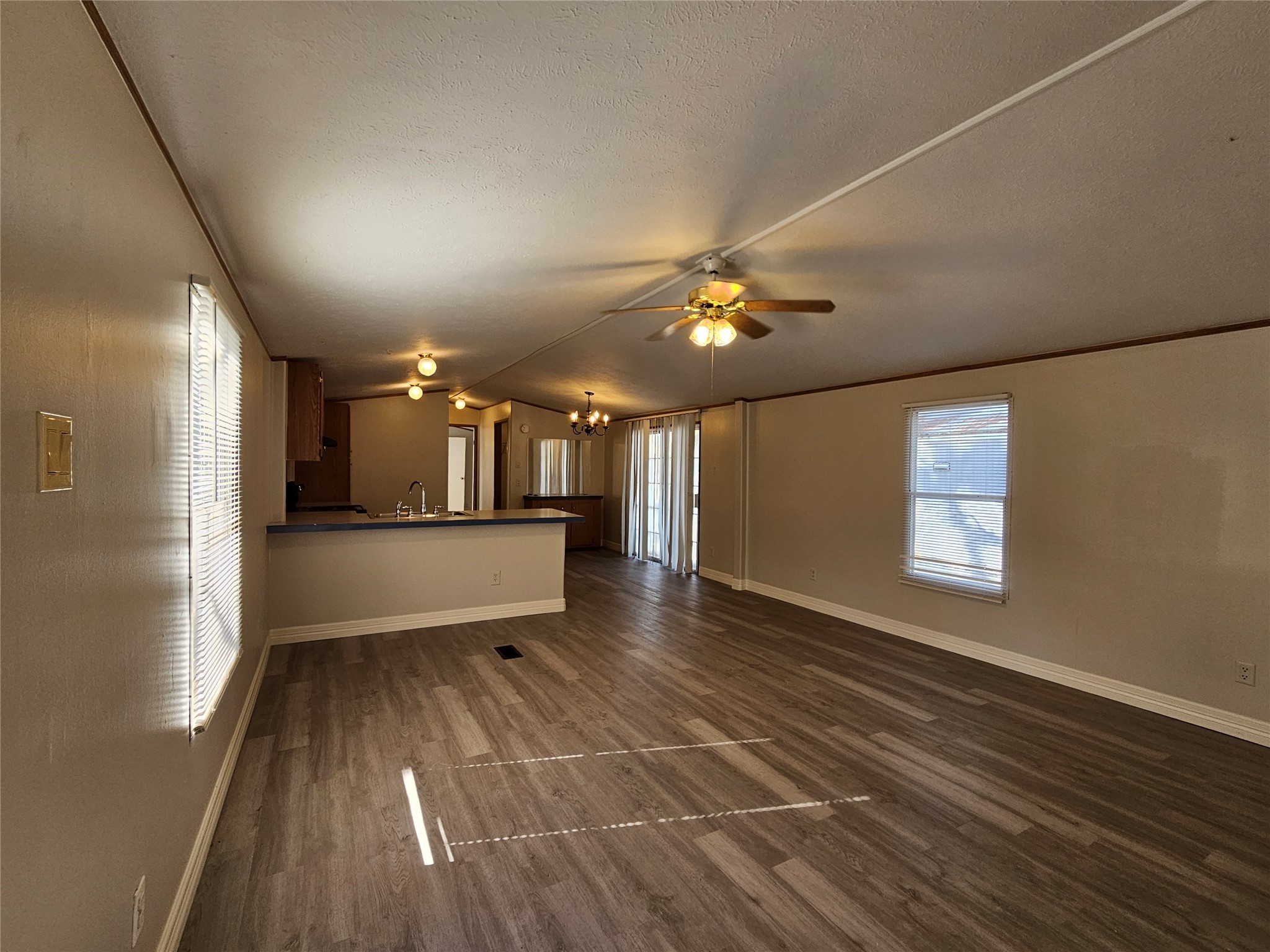 14225 East Ravine Run Willis, TX 77318 - Photo 6 of 27 a view of an empty room with window and wooden floor