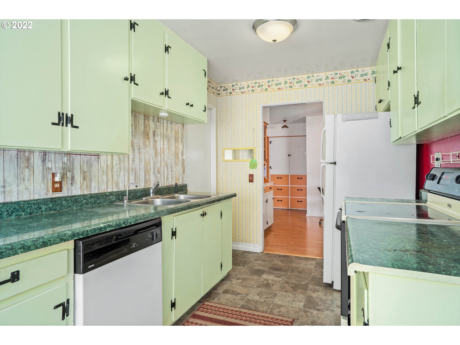 1779 Carroll Street Lebanon, OR 97355 - Photo 11 of 27 a kitchen with granite countertop a sink and cabinets