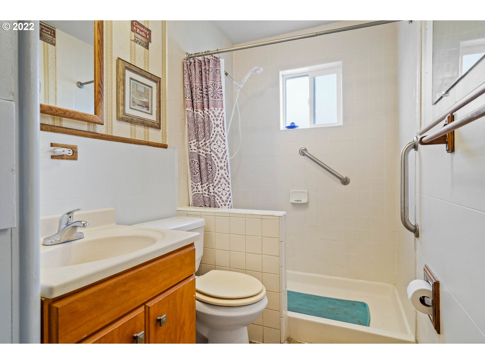 1779 Carroll Street Lebanon, OR 97355 - Photo 15 of 27 a bathroom with a sink a toilet and a mirror