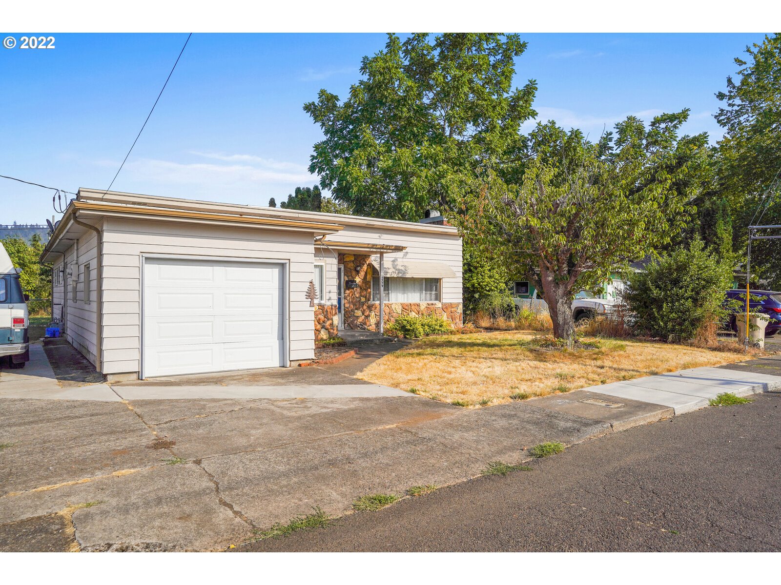 1779 Carroll Street Lebanon, OR 97355 - Photo 2 of 27 a view of a house with a outdoor space and yard