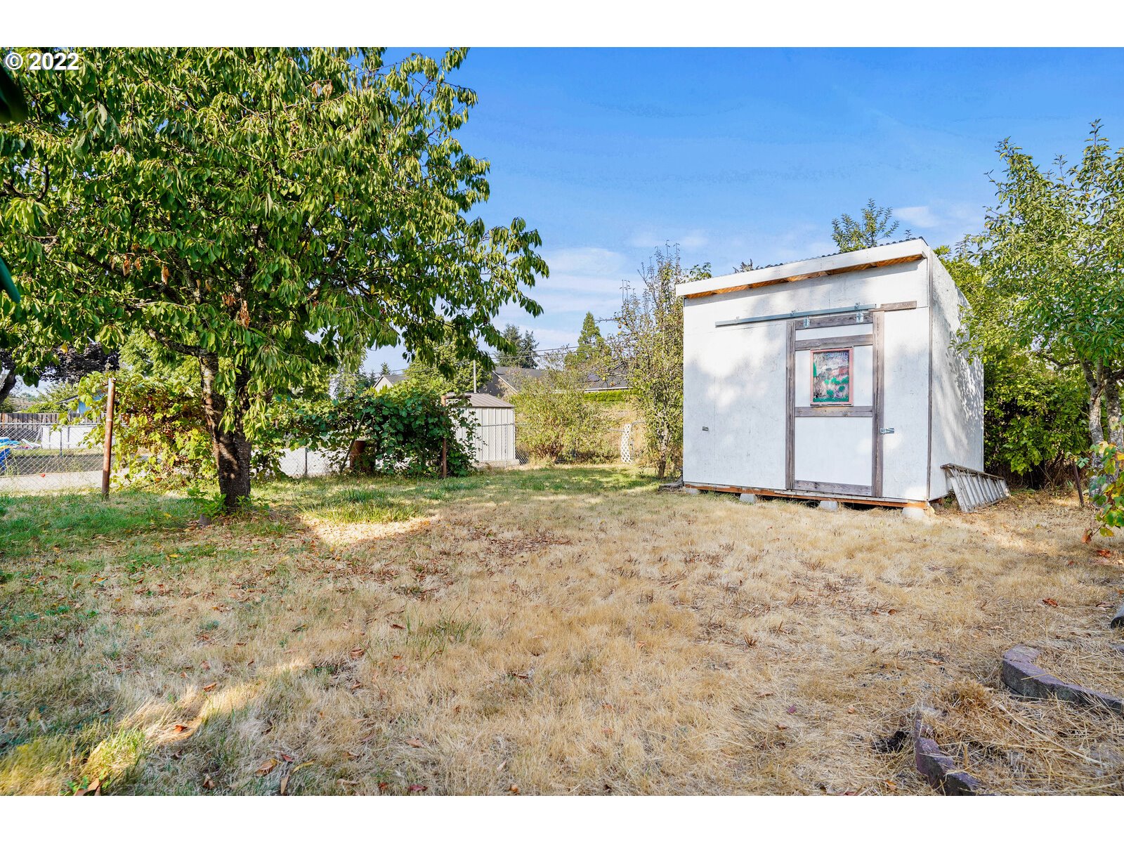 1779 Carroll Street Lebanon, OR 97355 - Photo 21 of 27 a view of garage and yard