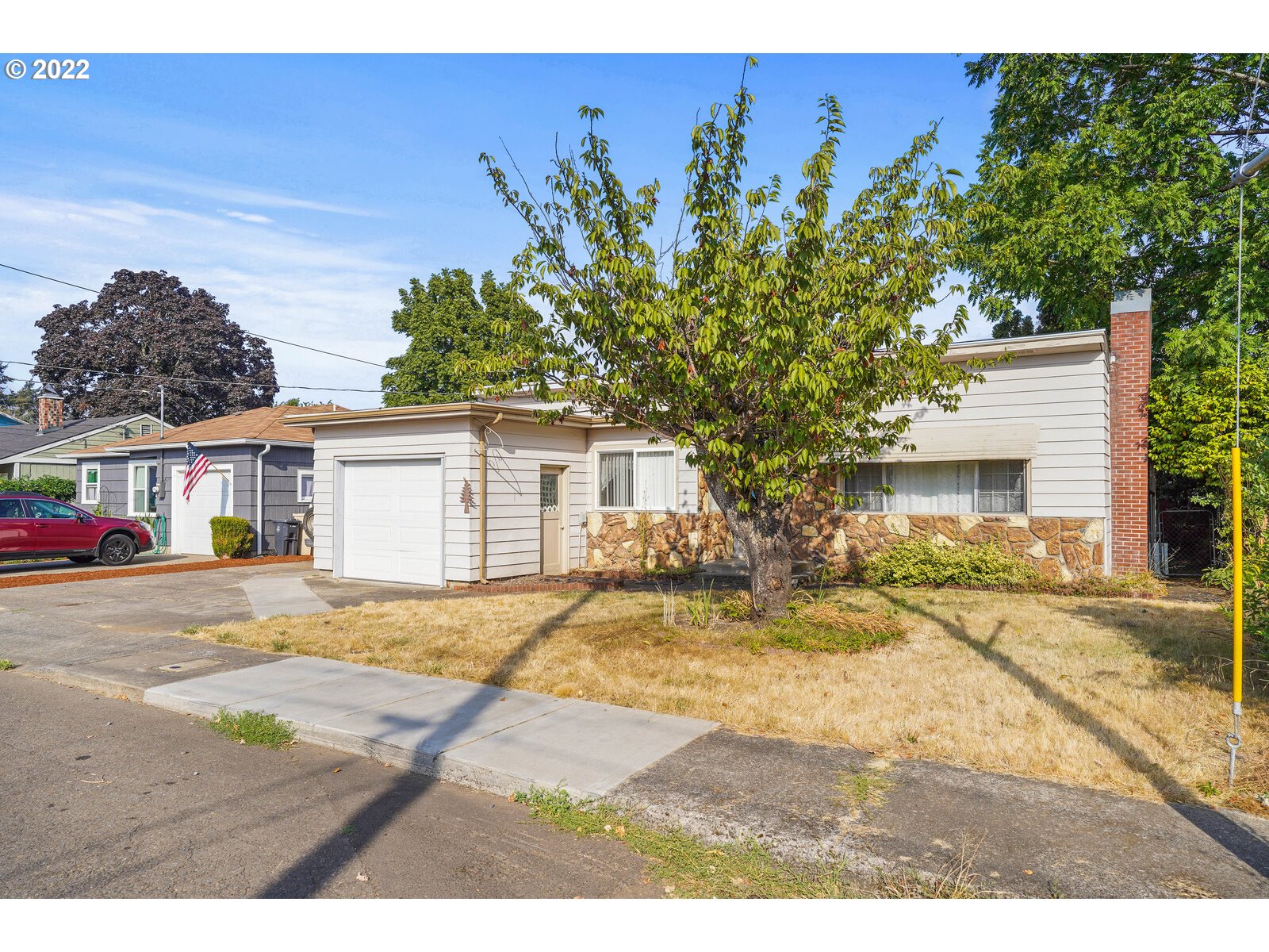 1779 Carroll Street Lebanon, OR 97355 - Photo 3 of 27 a view of a house with a yard and street