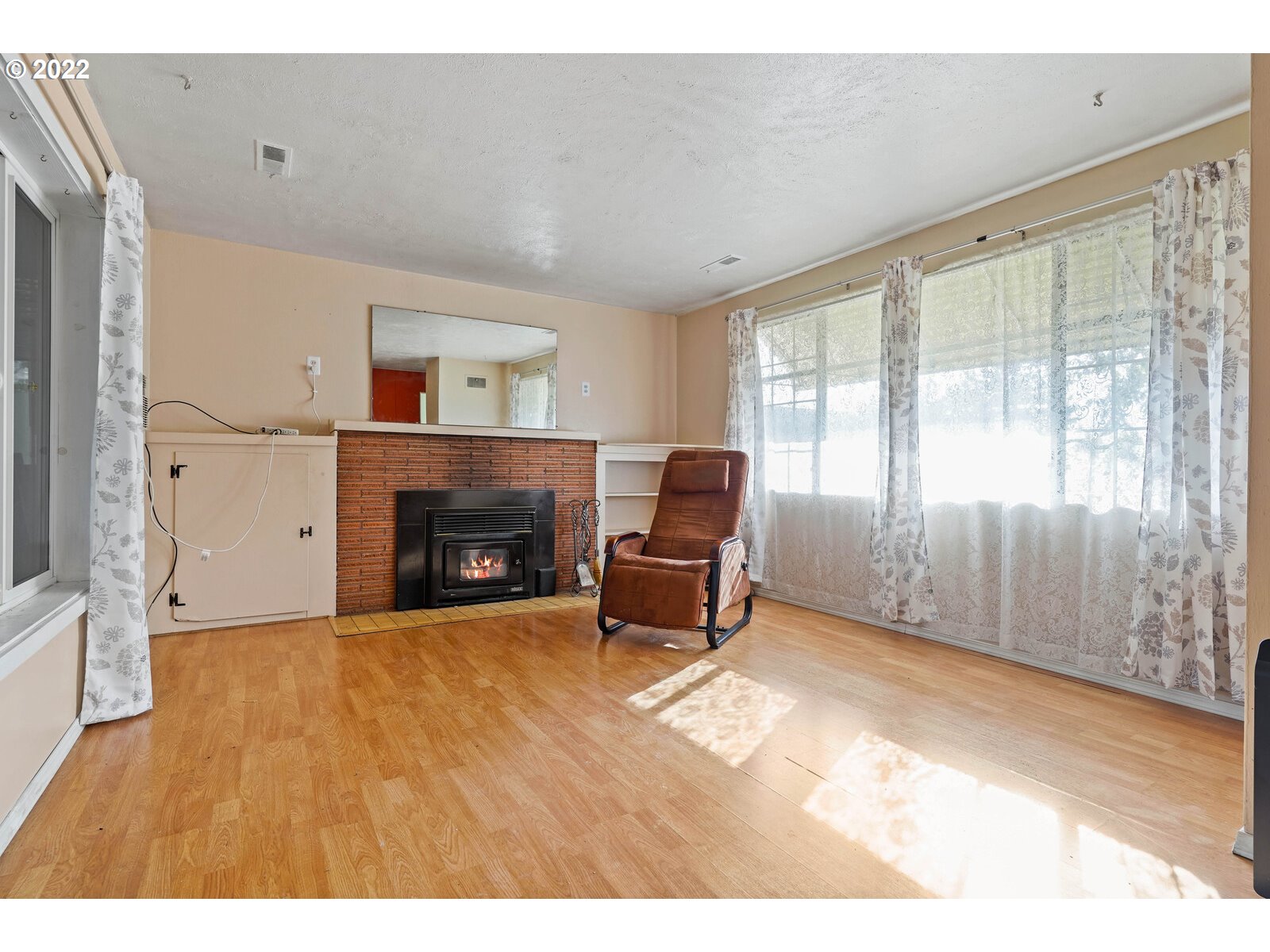 1779 Carroll Street Lebanon, OR 97355 - Photo 5 of 27 a living room with furniture and a fireplace