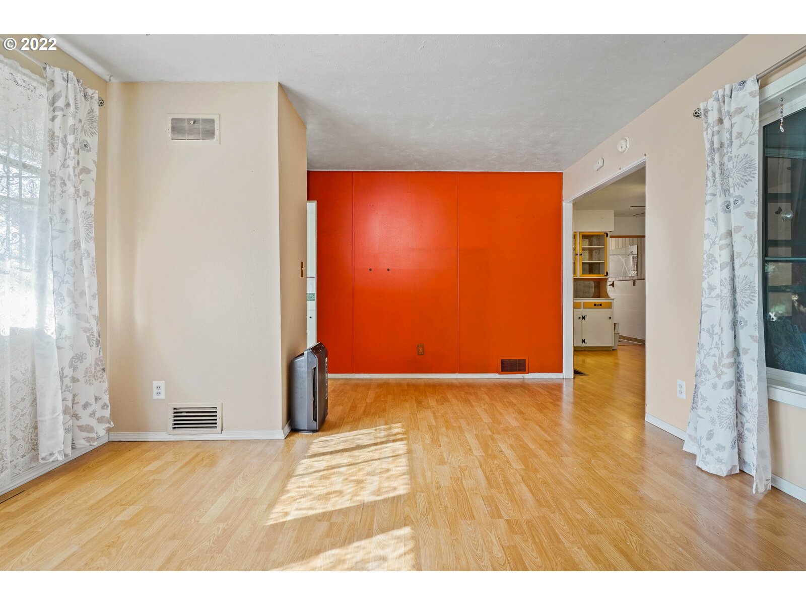 1779 Carroll Street Lebanon, OR 97355 - Photo 6 of 27 a view of an empty room with wooden floor and a window