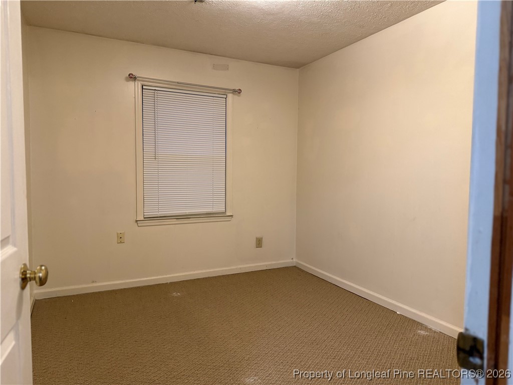 308 Lewis Street Red Springs, NC 28377 - Photo 16 of 18 an empty room with a window