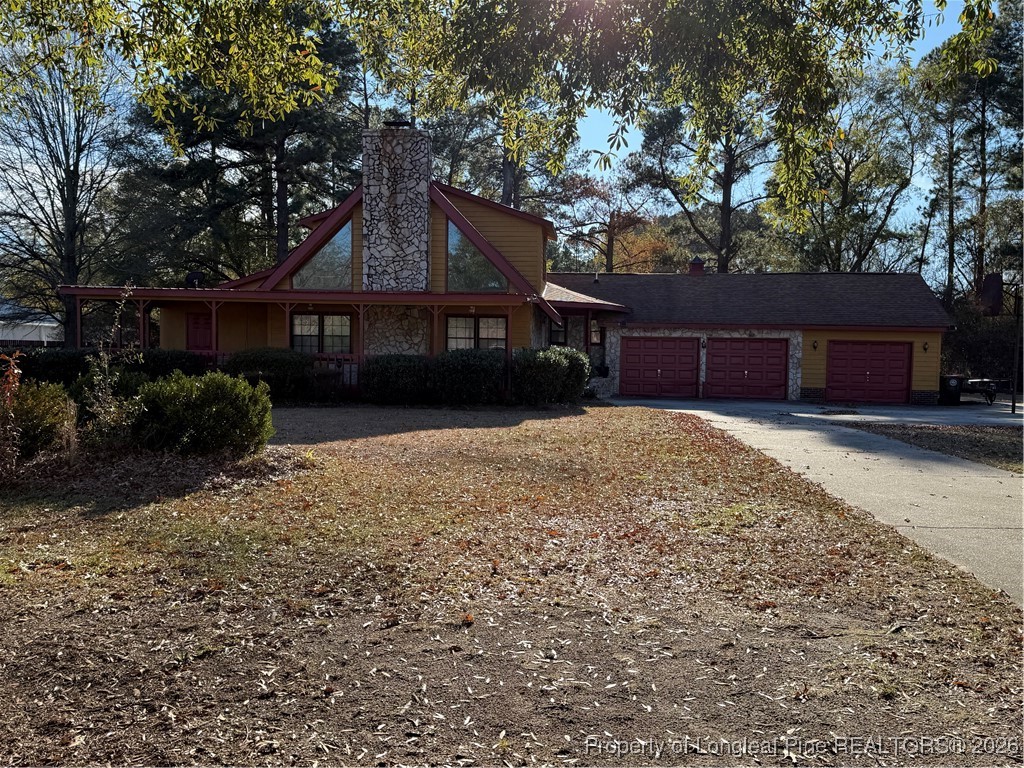 308 Lewis Street Red Springs, NC 28377 - Photo 9 of 18 front view of a house with a yard