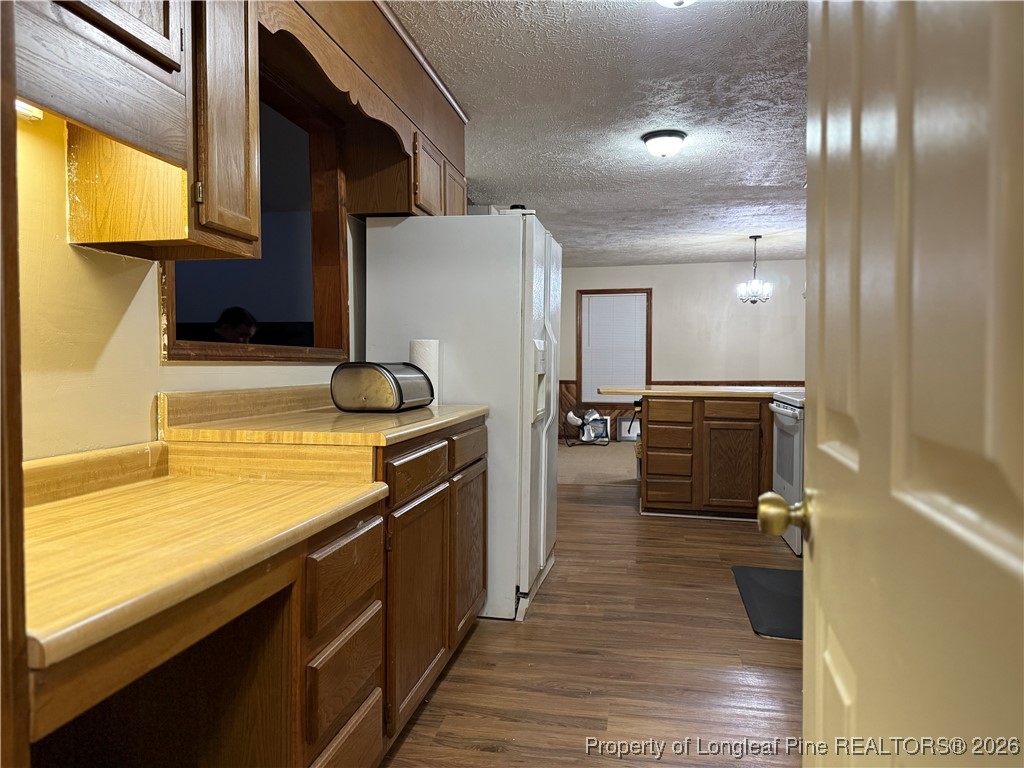 308 Lewis Street Red Springs, NC 28377 - Photo 10 of 18 a kitchen with a sink appliances cabinets and furniture