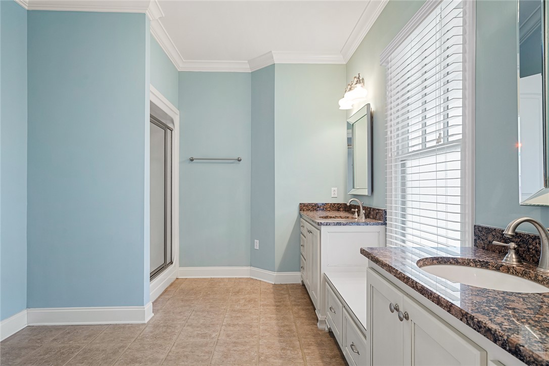 16 Oleander Drive Anderson, SC 29621 - Photo 25 of 37 Granite counters and dual vanities elevate this light and airy bathroom, ready for your personal touch.