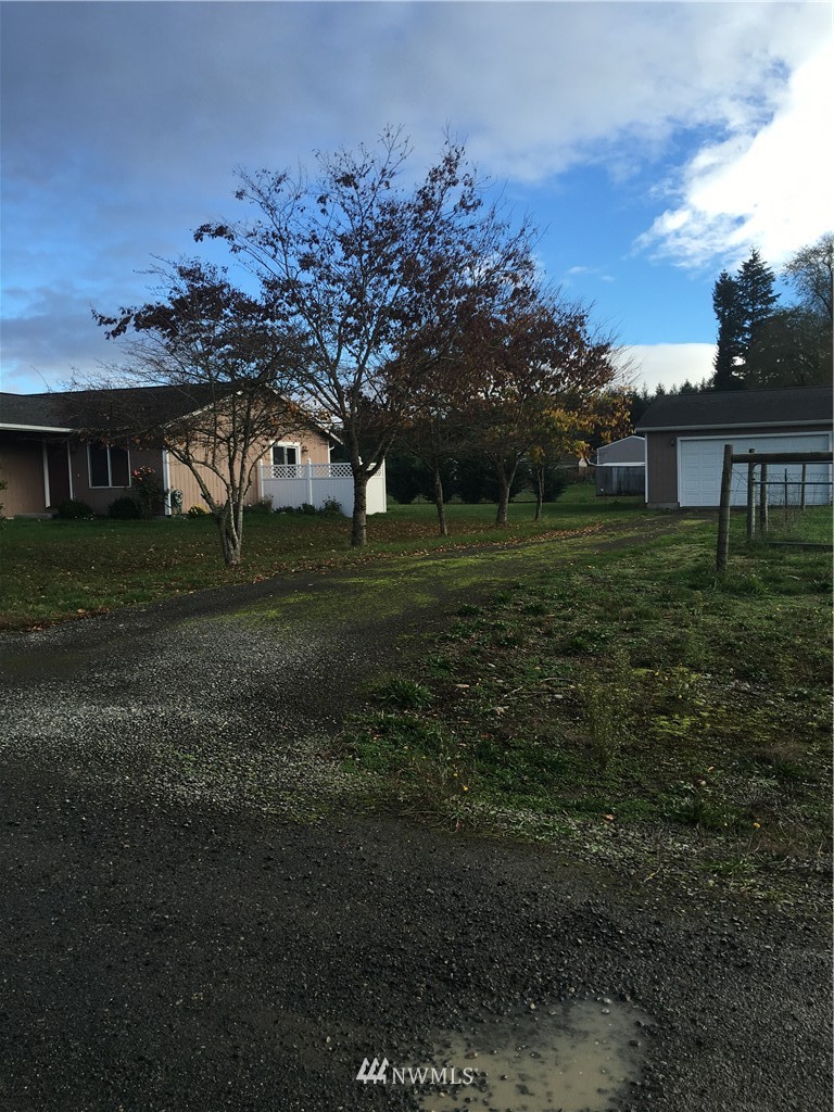 18234 Tamara Lane Southwest Rochester, WA 98579 - Photo 1 of 25 a front view of a house with a yard