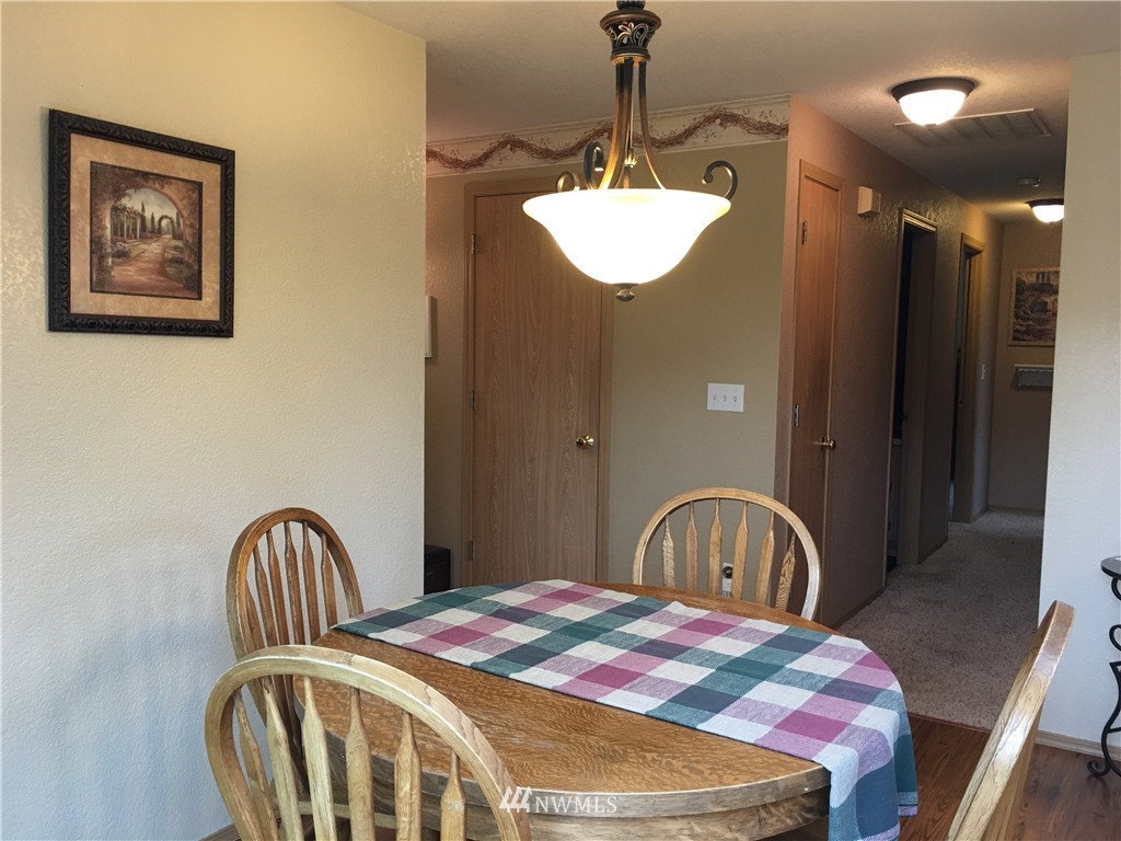 18234 Tamara Lane Southwest Rochester, WA 98579 - Photo 20 of 25 a bedroom with a bed and a chandelier