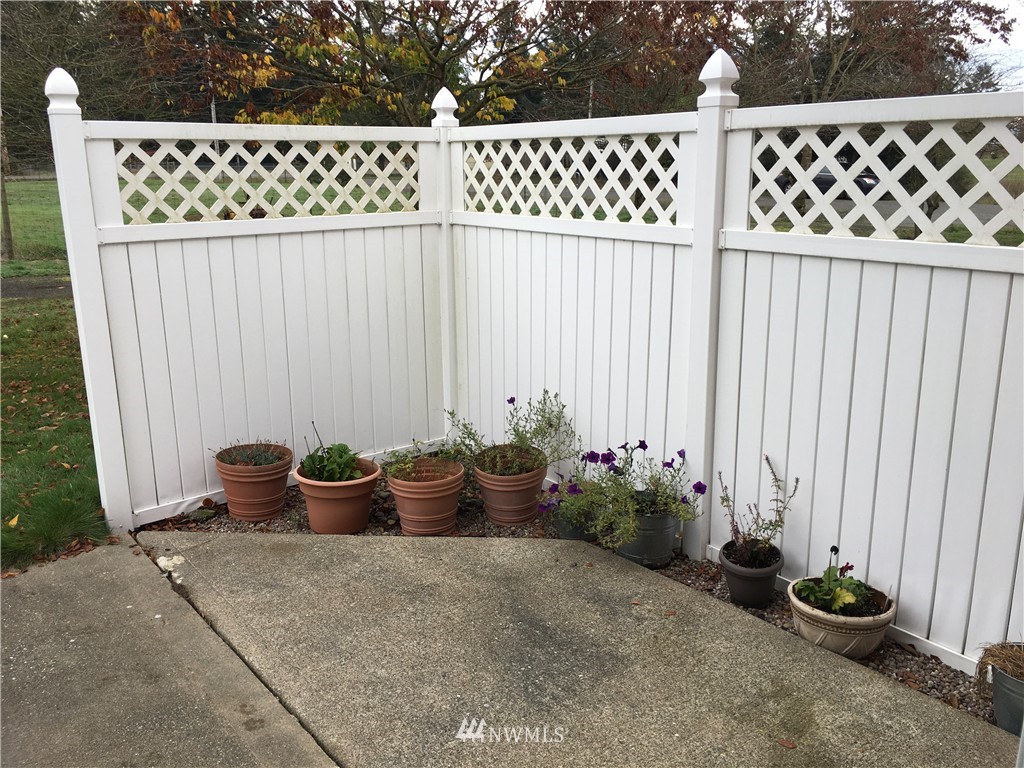 18234 Tamara Lane Southwest Rochester, WA 98579 - Photo 23 of 25 a view of a chair and table in back yard of a house