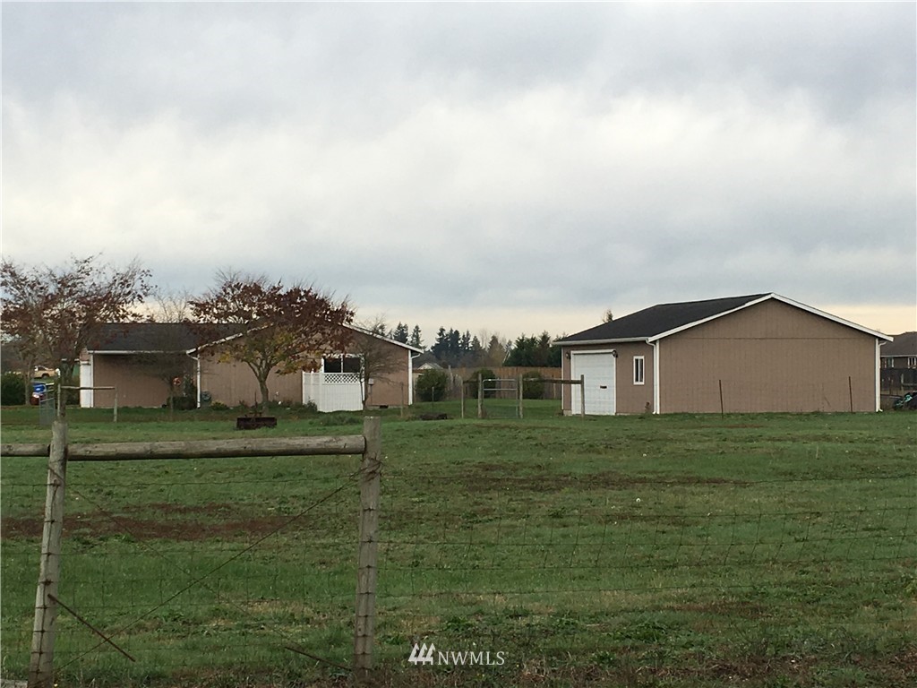 18234 Tamara Lane Southwest Rochester, WA 98579 - Photo 25 of 25 a big house with a big yard and large trees