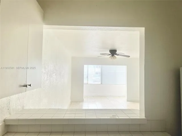 a kitchen with a sink cabinets and stainless steel appliances