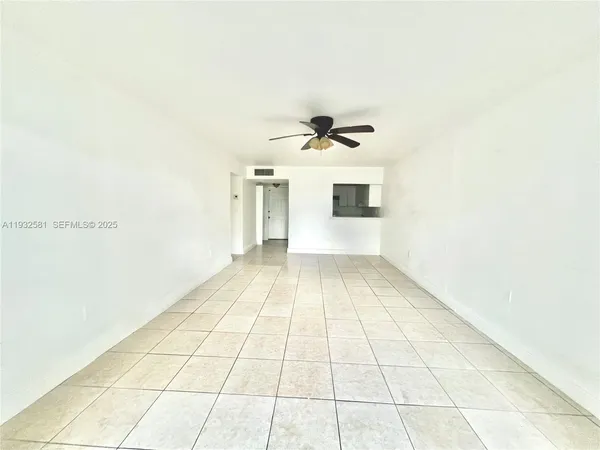 a view of an empty room with a window