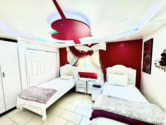 a bathroom with a sink and mirror with bathtub